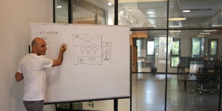Analyst explaining to his team helpful information to improve business