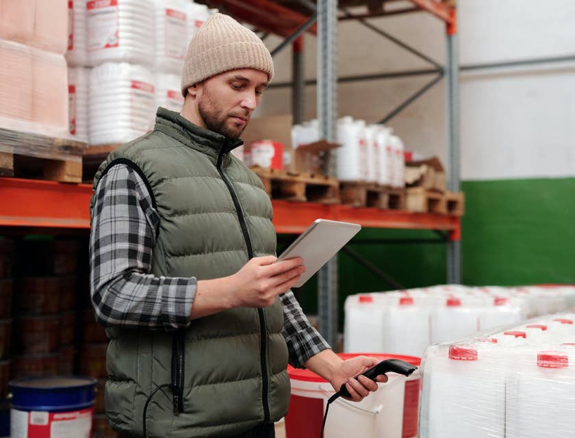 Associate Product Manager gathers product data and analyzes it on a tablet.