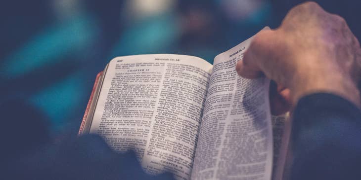 A Christian man reading a Bible.