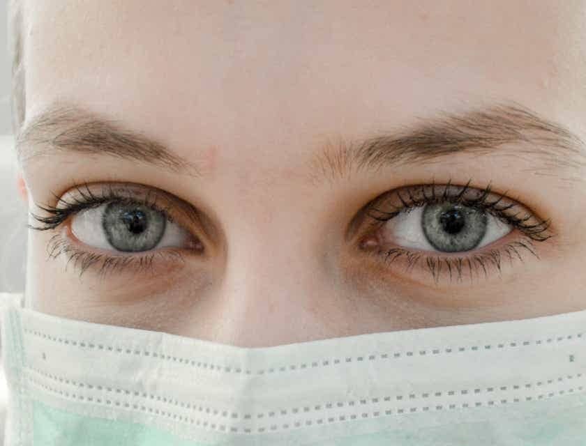 A medical assistant wearing a surgical mask.
