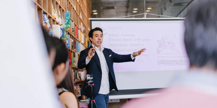Business Consultant discusses project plans to new clients