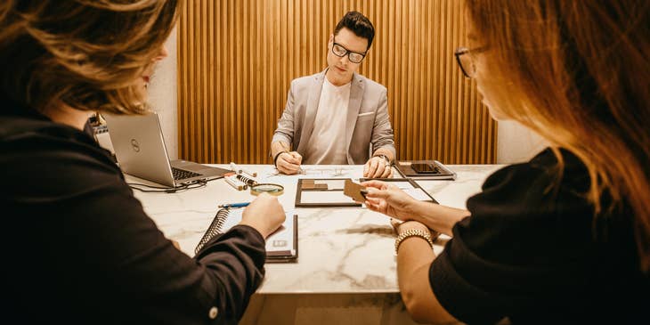 Business Development Analyst writes down new marketing strategies for their clients