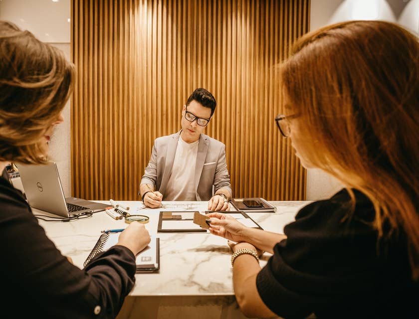 Business Development Analyst writes down new marketing strategies for their clients