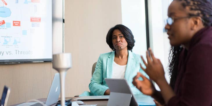 Chief Human Resources Officer listens to staff as they discuss new training programs for the company