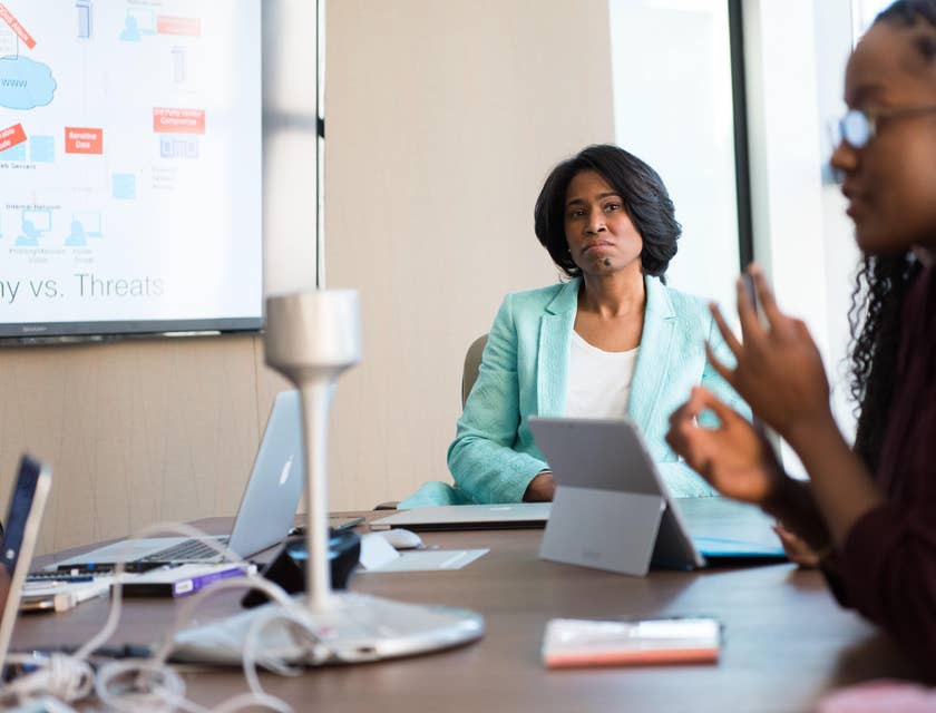 Chief Human Resources Officer listens to staff as they discuss new training programs for the company