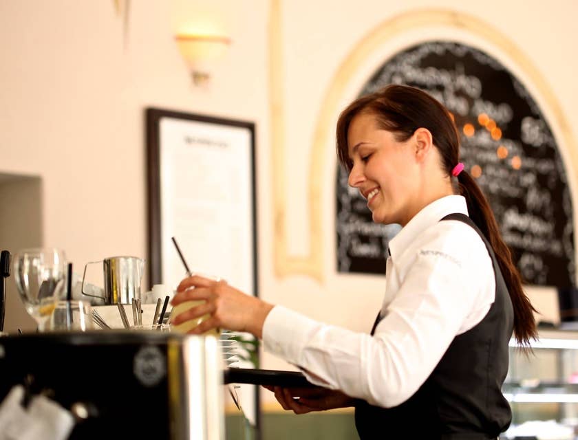 Cocktail Waitress getting ready to serve a drink to a valued customer.