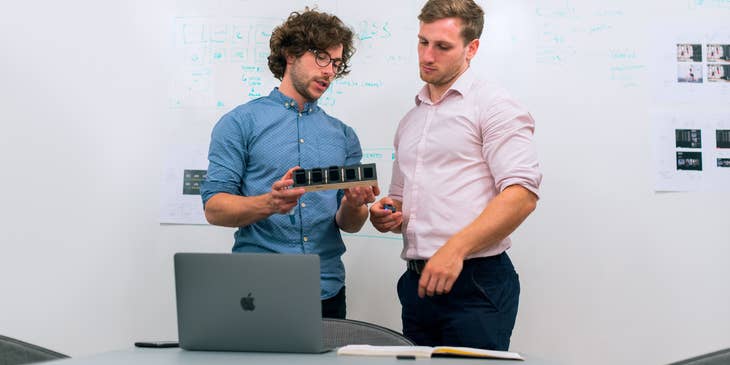 An engineering consultant meeting with a client to share technical solutions.