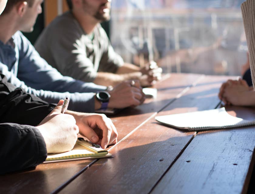 The event planner is conceptualizing theme ideas and planning budgets with his team.