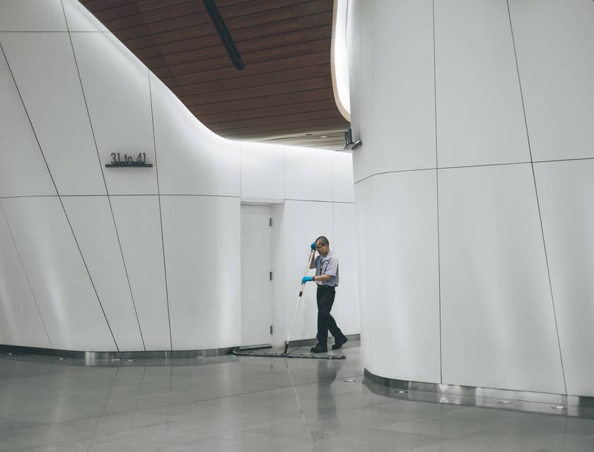 Facilities Manager cleaning floors in a building