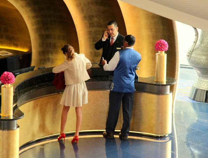 Front Desk Agent assists a guest who left her room keys.
