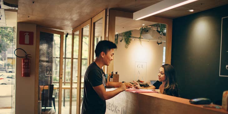 Front Office Assistant talking to a visitor