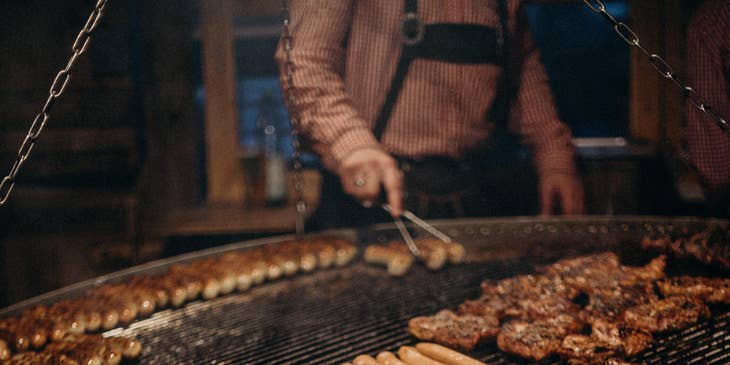 Grill Cook grilling patties and sausages.