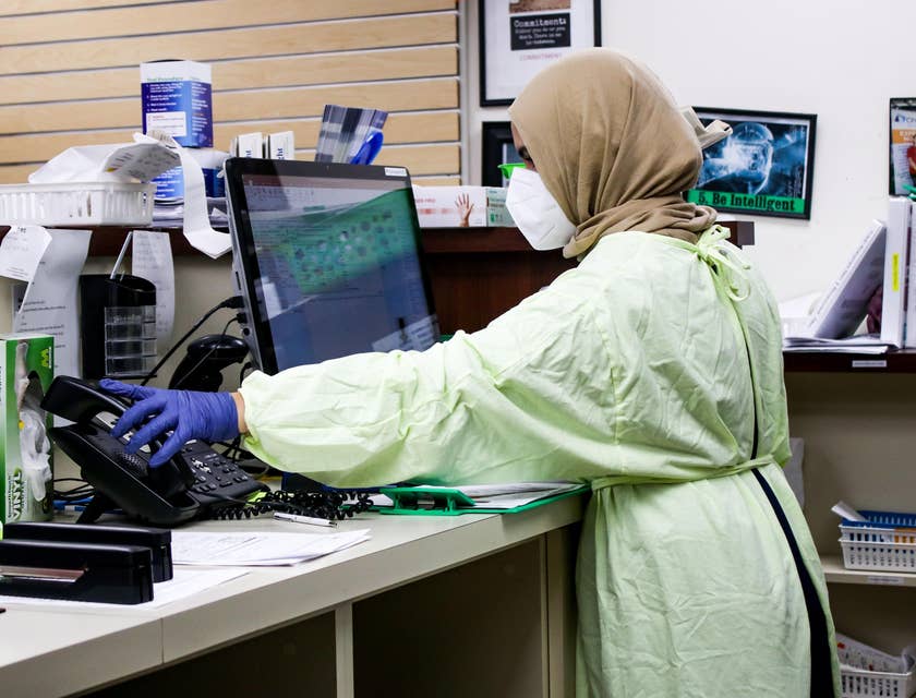 Hospital registrar standing in front of a desk