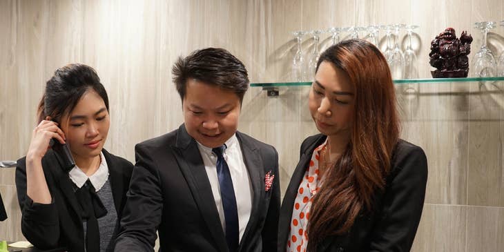 A hotel manager discussing to his staff.
