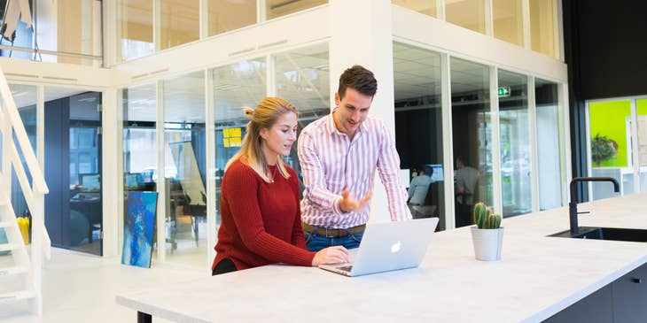 Image Consultant is showing his client ways to improve business image.