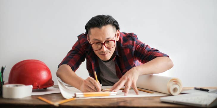 Independent Contractor working on new designs in his home office
