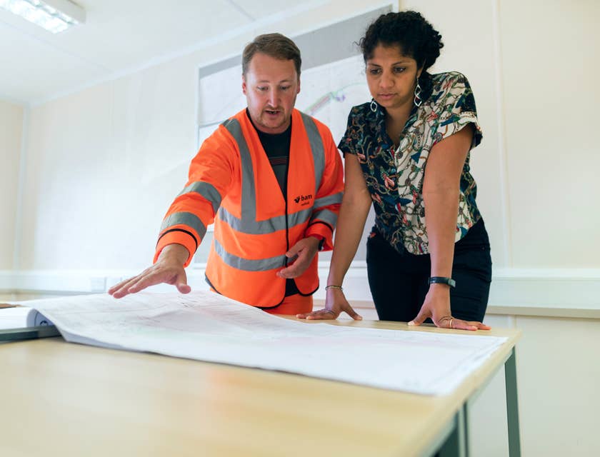Industrial Hygienist collaborating with management to discuss safety and policies