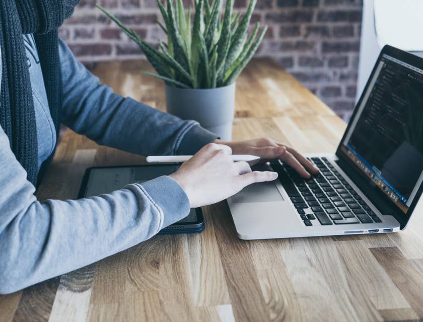 Java developer working behind a laptop.