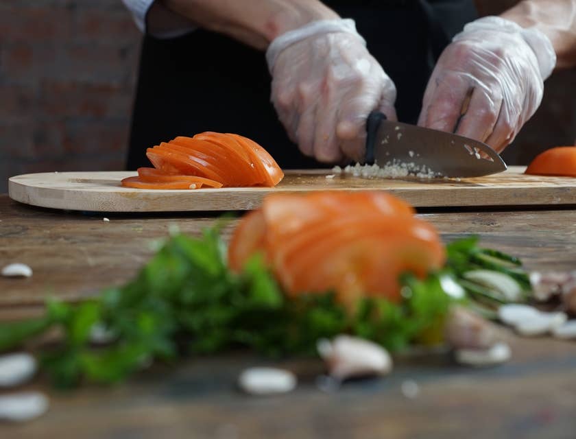 A lead line cook preparing ingredients.