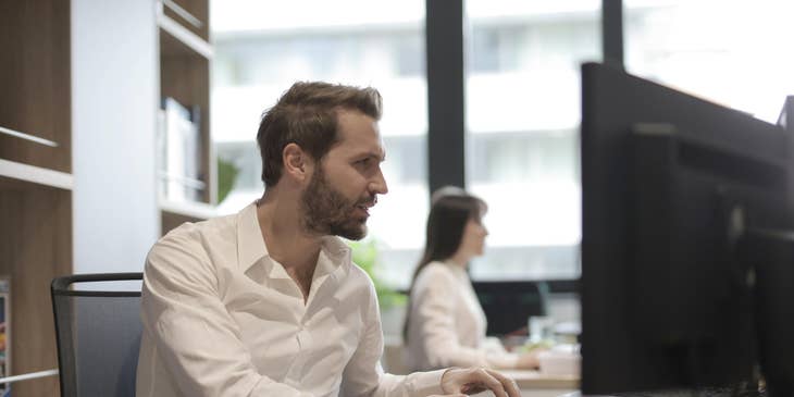 Management accountant reviews financial data to implement cost-financial strategies for the company