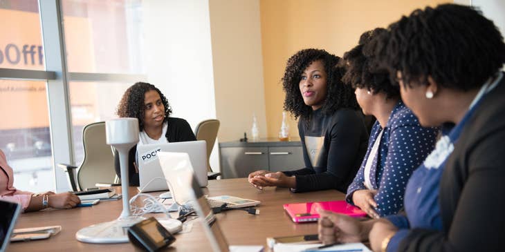 Market Research Analyst discusses marketing plans during their conference.