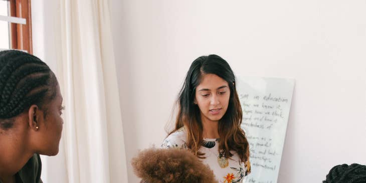 Organizational consultant analyzing new business model with her team.