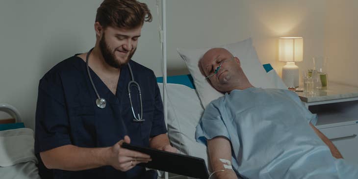 PACU nurse updates the patient's record in the recovery room