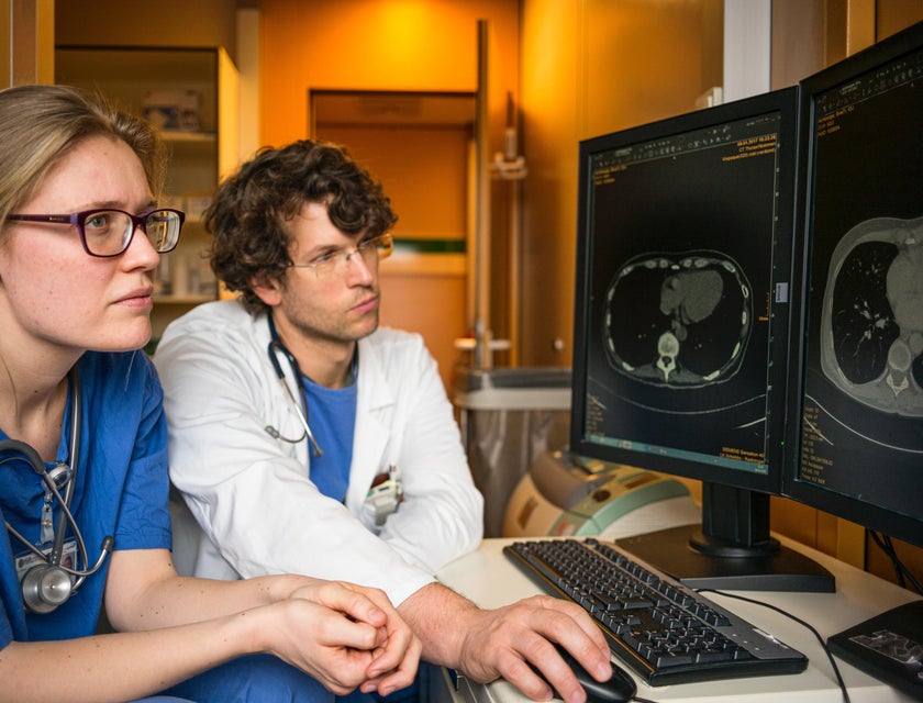 Pediatric oncologist consults with a colleague to analyze MRI results