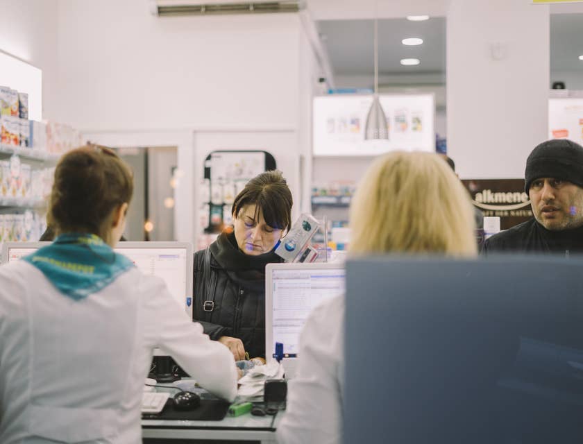 Pharmacy technician accepts written prescription from patients over the counter