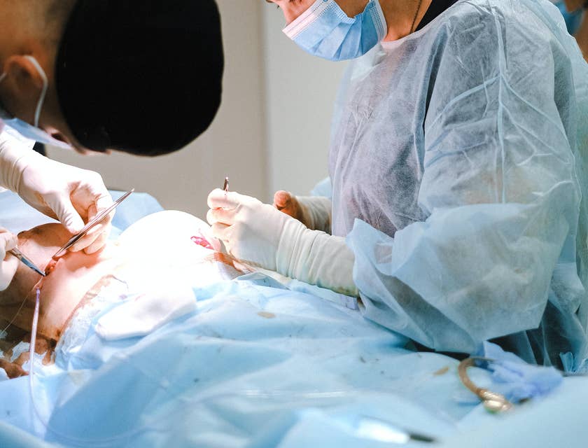 Plastic surgery nurse cleans open wound to prepare for treatment from the doctor.