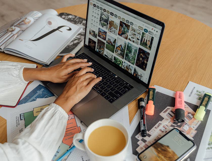 Product developer working on a new project while enjoying a cup of coffee.