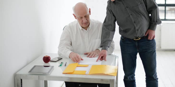 Program specialist showing his client on new activities for his employees.
