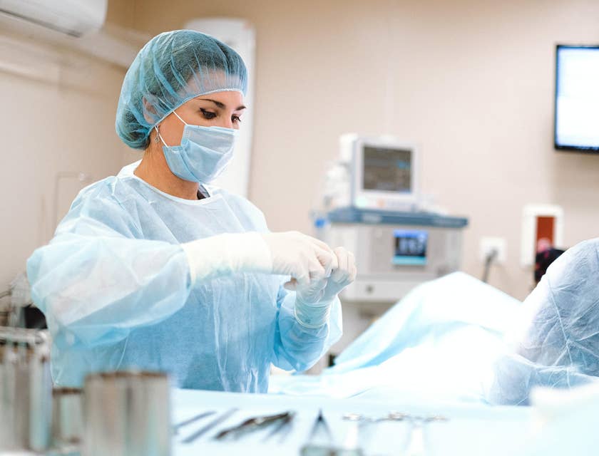 Progressive care nurse prepares sterilized equipment as they prepare for an operation