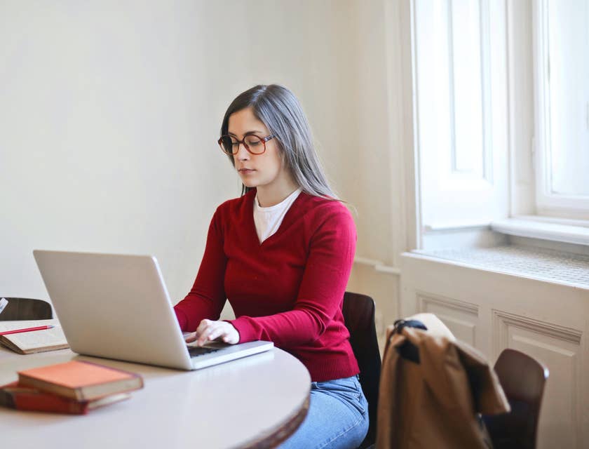 Project accountant reviews budget plan for a new client in a small office