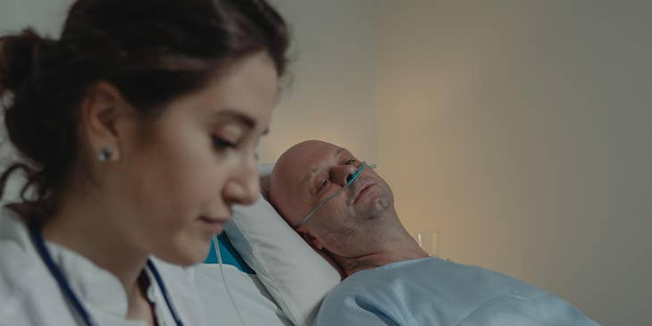 Psychiatric nurse monitoring mental health patient while administering medications