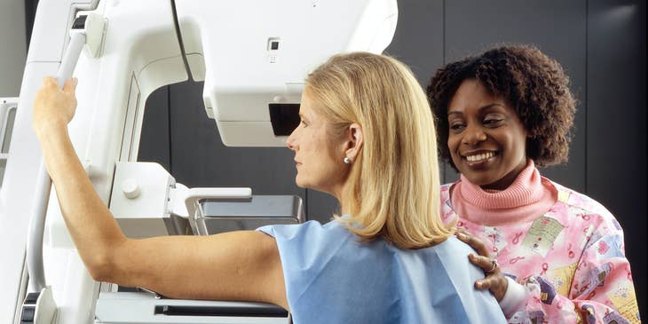 Radiologic technologist position patient for a mammogram procedure in a hospital