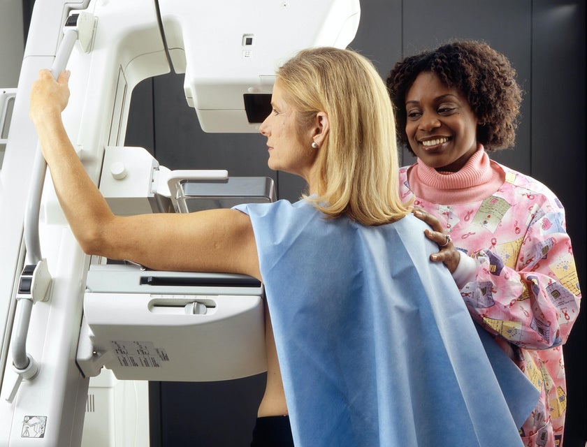 Radiologic Technologist position patient for a mammogram procedure in a hospital