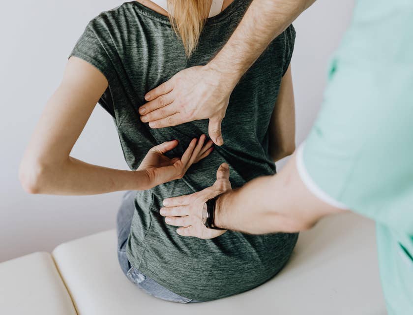 Rheumatologist evaluates back pain to design treatment plans for the patient