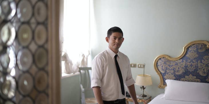Room attendant getting ready to service a guest's room.
