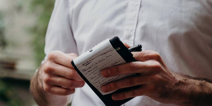 Restaurant server taking a customers order.