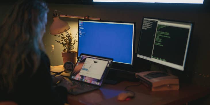Software Engineer is monitoring system performance while analyzing data
