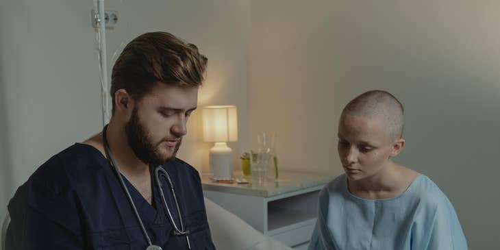 Staff nurse explains to patient treatment plans and medications as directed by the doctor
