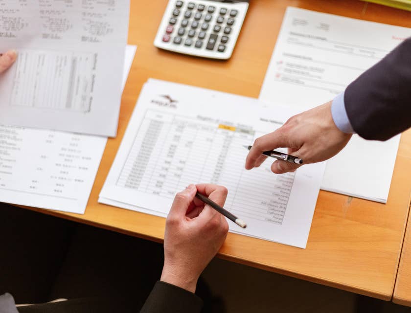 Statistical analyst collecting and analyzing data with a colleague