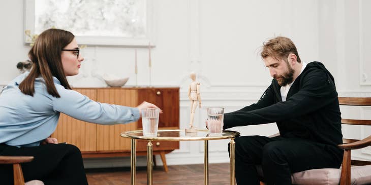 Substance abuse counselor facilitates patient with alcohol abuse during a therapy session
