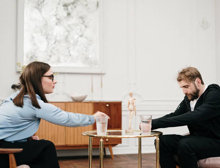Substance abuse counselor facilitates patient with alcohol abuse during a therapy session