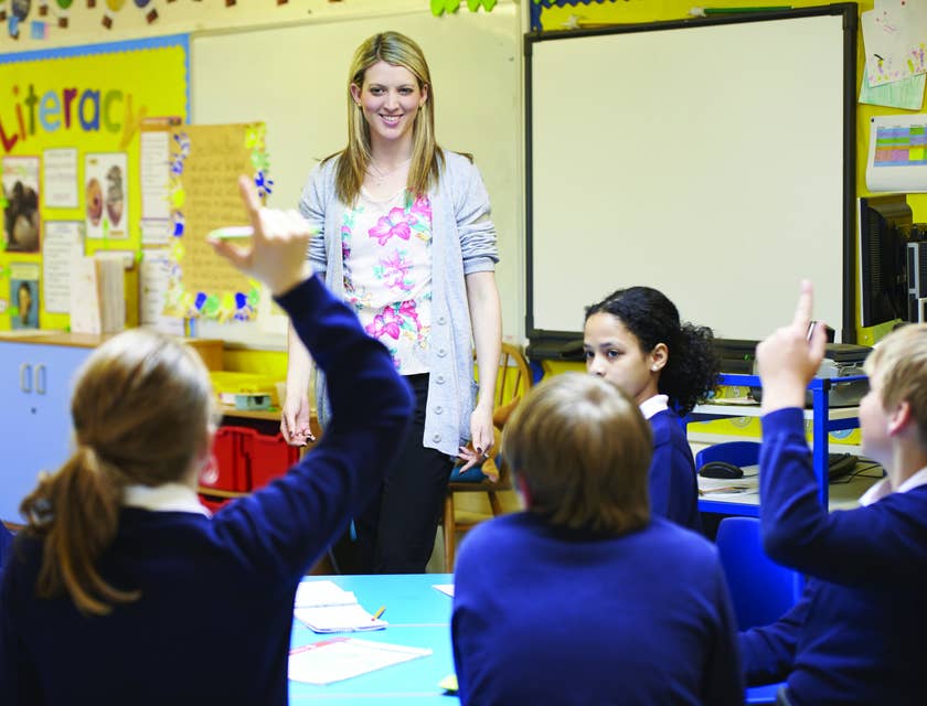 Substitute Teacher listens to her students' questions during class