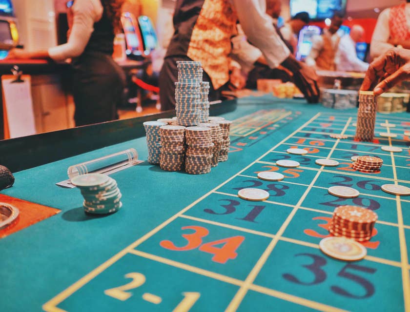 Table games dealer preparing cash chips.