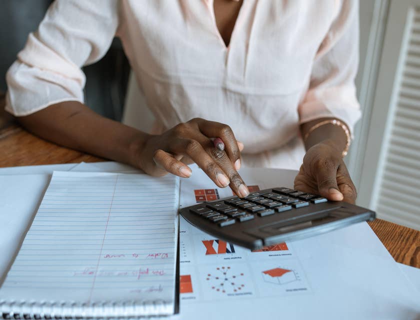 Tax Auditor evaluating tax refunds while working on a report for a business company
