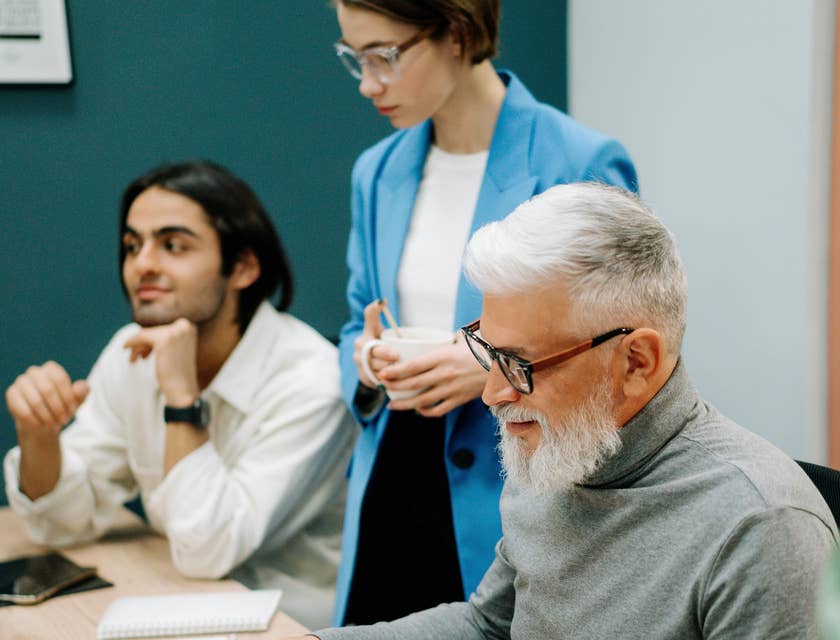 Training Consultant checks updated learning materials during the meeting