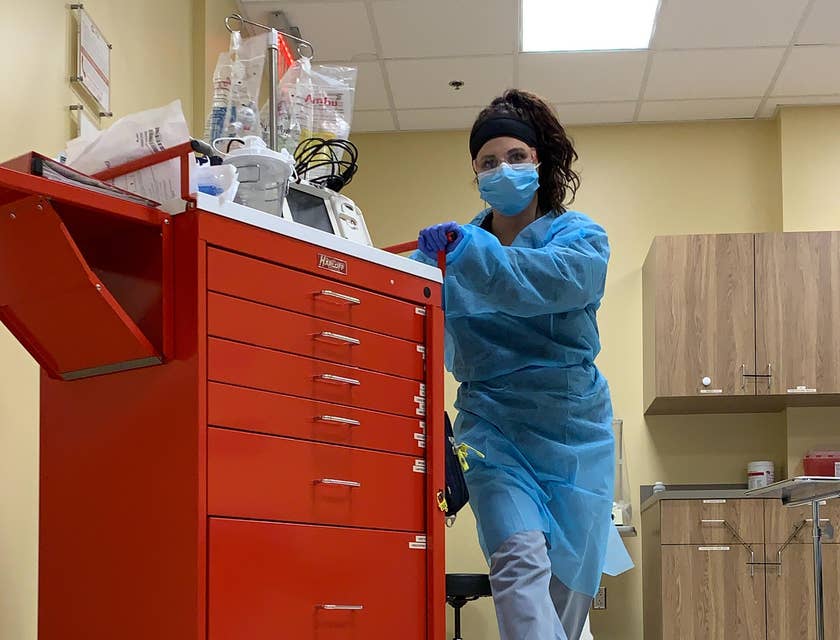 Trauma nurse push a crash cart due to an emergency in the hospital
